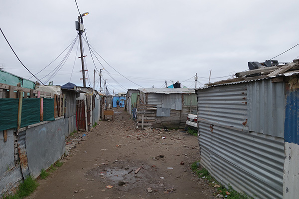 Shacks in close proximity of each other, located in Masiphumelele,