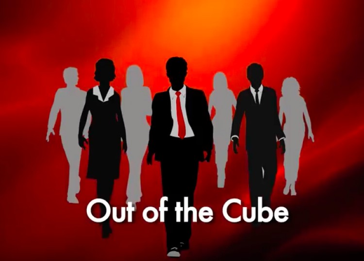 Illustration of professional men and women in suits, walking, with written text "Out of the Cube"