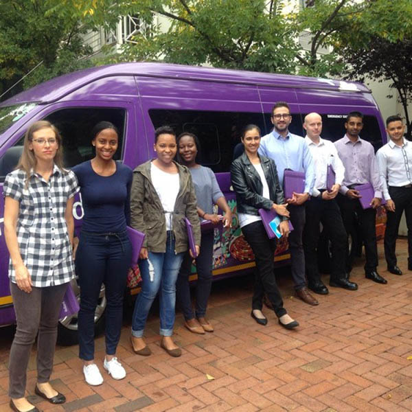 The GIB Team standing in front of a Hollard-branded minibus.
