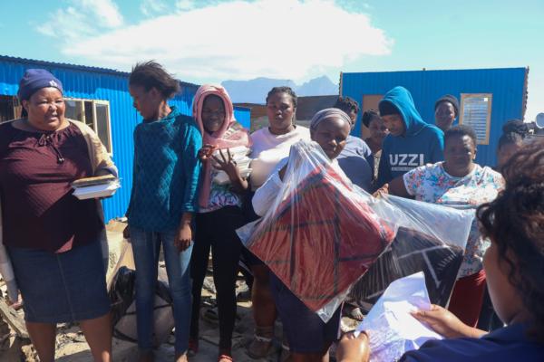 Stepping up for the community: Lumkani and Zibonele FM join forces to deliver aid to fire victims