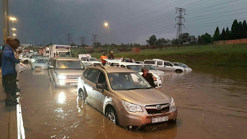 Vehicles in flash floods in the road