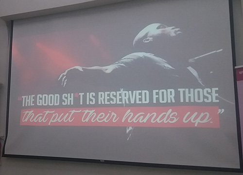 Slide with "The good sh*t is reserved for those that put their hands up" text